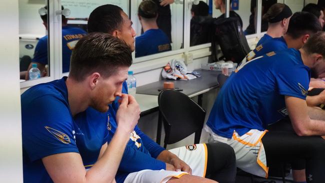 Brisbane Bullets players listen to the pre-game address from head coach Andrej Lemanis