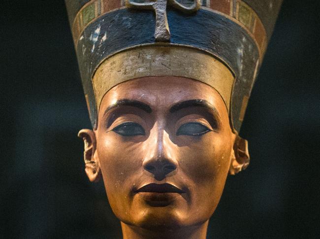 FILE - In this Sept. 10, 2014 file photo, a 3,300-year-old bust of Queen Nefertiti stands on its socle, at the New Museum in Berlin, Germany. An Egyptian official says the Antiquities Ministry gave an initial approval for the use of non-invasive radar to verify a theory that Queen Nefertiti’s crypt may be hidden behind King Tutankhamun’s 3,300-year-old tomb in the famous Valley of the Kings. (AP Photo/Markus Schreiber, File)