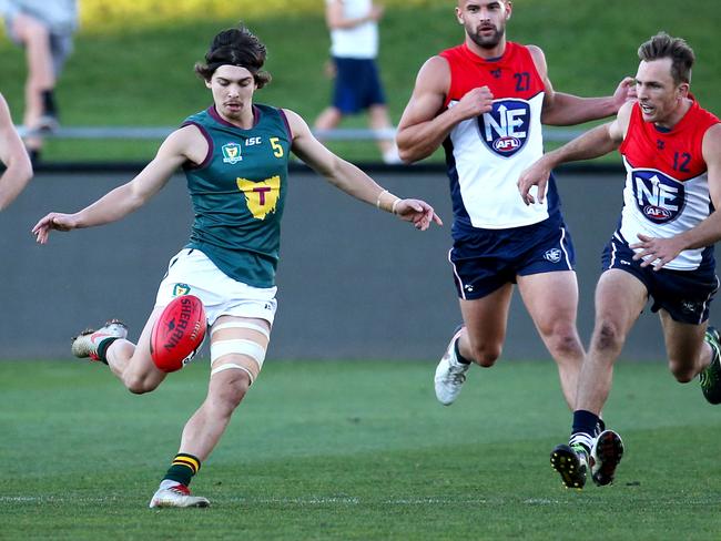 Tasmania's Jay Lockhart kicks forward against the NEAFL representative side. Picture: PATRICK GEE