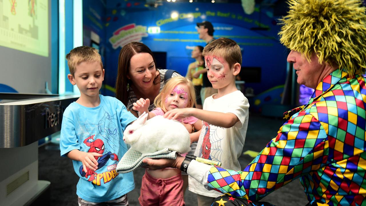 Reef HQ Aquarium's farewell party before they close for renovations. Julia Brink with kids Willem 7, Finley 4 and Eli 7 with Stewit the Rabbit and Windy Wizard Picture: Alix Sweeney