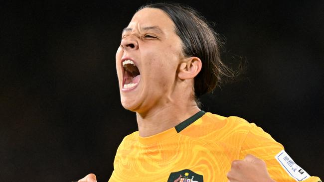 FILES-- This file photo taken on August 16, 2023 shows Australia's forward Sam Kerr celebrating scoring her team's first goal during the Australia and New Zealand 2023 Women's World Cup semi-final football match between Australia and England at Stadium Australia in Sydney. Chelsea and Australian women's football star Sam Kerr has been charged with a "racially aggravated offence" in Britain following a dispute involving a police officer, London's Metropolitan Police said March 4. The 30-year-old striker, one of the highest profile and best-paid players in the women's game, was charged following an incident in London in January 2023, a police statement read. (Photo by IZHAR KHAN / AFP)