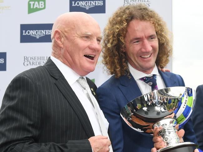 (R to L) Jockey Hugh Bowman, trainer Ciaron Maher and owner Col Mckenna hold the trophy after Jameka 2 won race 6, The BMW, on Legends Day at Rosehill Racecourse in Sydney on Saturday, March 25, 2017. (AAP Image/Paul Miller) NO ARCHIVING, EDITORIAL USE ONLY