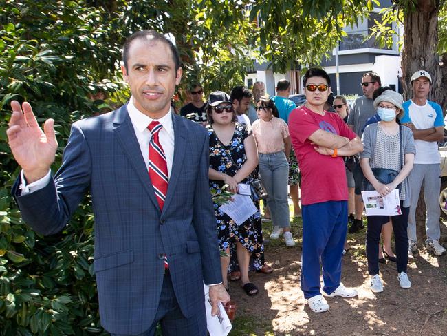 Pictures from the auction of 70, Ulm Street, Ermington, taken on 13th March 2021.The property fetched over $1.8 million and was the family home where the Seage sisters grew up.Picture shows auctioneer Rocky Bartolotto with crowds at the auction.(Pictures by Julian Andrews).