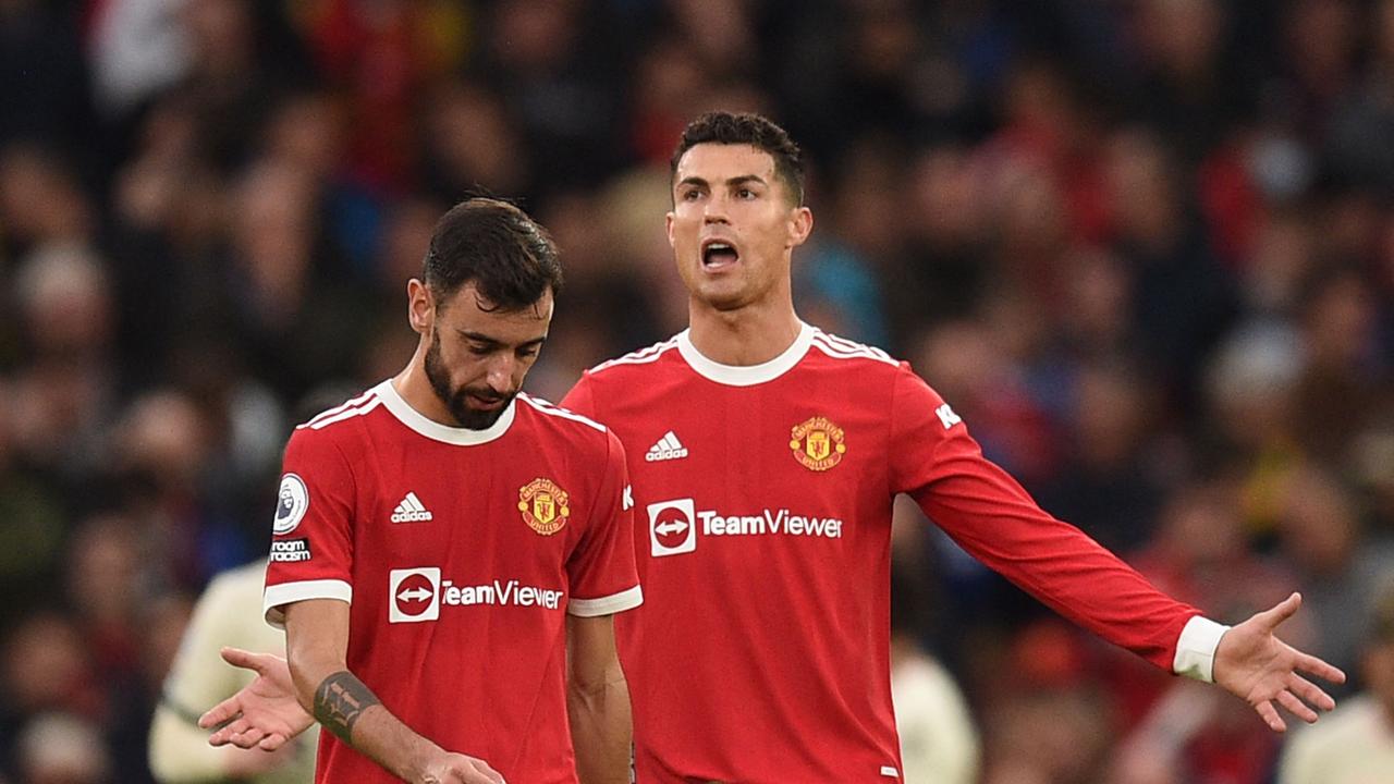 Manchester United's Portuguese striker Cristiano Ronaldo reacts after Liverpool scored their third goal during the English Premier League football match between Manchester United and Liverpool at Old Trafford in Manchester, north west England, on October 24, 2021. (Photo by Oli SCARFF / AFP) / RESTRICTED TO EDITORIAL USE. No use with unauthorized audio, video, data, fixture lists, club/league logos or 'live' services. Online in-match use limited to 120 images. An additional 40 images may be used in extra time. No video emulation. Social media in-match use limited to 120 images. An additional 40 images may be used in extra time. No use in betting publications, games or single club/league/player publications. /