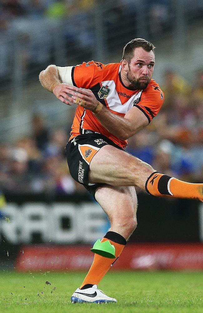 Tigers winger Pat Richards kicks a penalty goal from halfway.