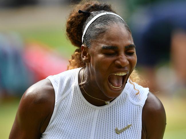 TOPSHOT - US player Serena Williams reacts after a point against Czech Republic's Barbora Strycova during their women's singles semi-final match on day ten of the 2019 Wimbledon Championships at The All England Lawn Tennis Club in Wimbledon, southwest London, on July 11, 2019. (Photo by Daniel LEAL-OLIVAS / AFP) / RESTRICTED TO EDITORIAL USE