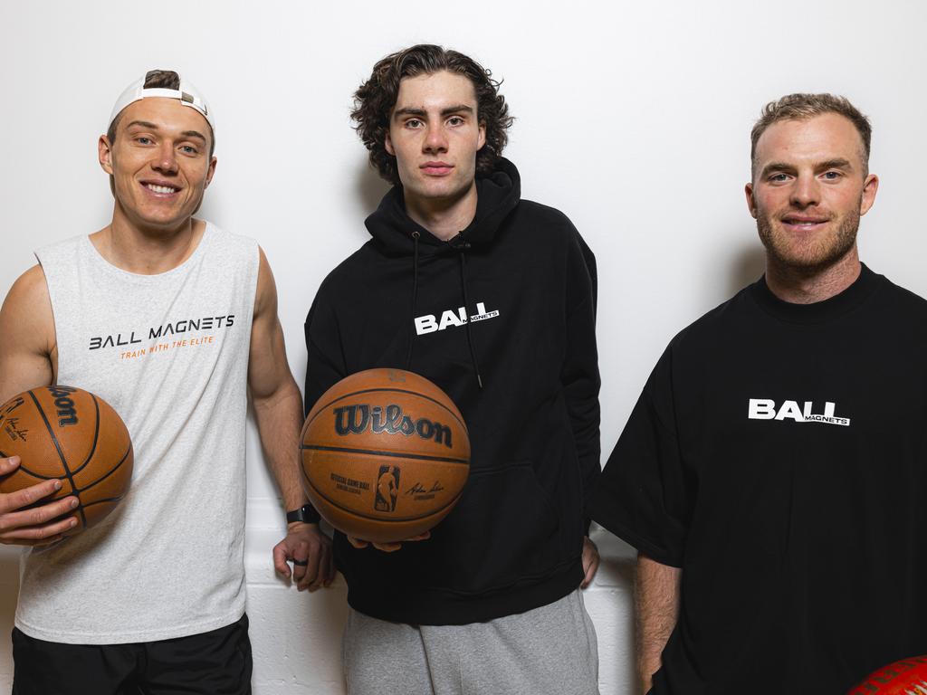 Aussie NBA star Josh Giddey has joined AFL stars Tom Mitchell (black) and Patrick Cripps (white) as a co-owner and content creator for the popular fitness and skills app Ball Magnets. Picture: NBAE/Getty Images