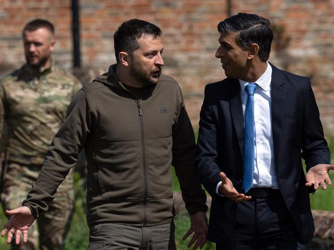 Britain's Prime Minister Rishi Sunak (R) talks with Ukraine's President Volodymyr Zelenskyy, as he walks with him to a waiting Chinook helicopter following their meeting at Chequers. Picture: AFP