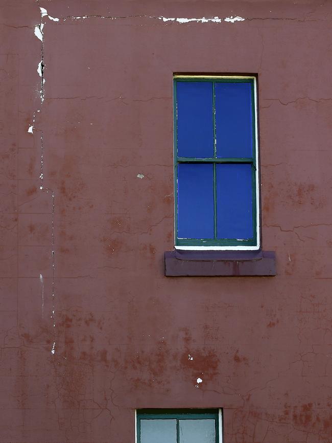 The cracked exterior — the building leaks during rain.