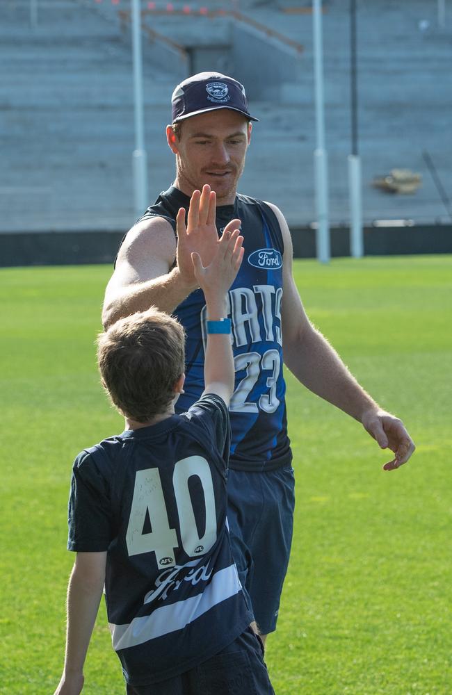 Gary Rohan dishes a hi-five. Picture: Brad Fleet