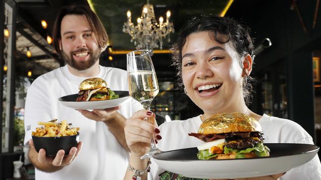 Royce Hodgson and Maiah Whiting with the Nouveau Riche Burger from Burger Urge at Windsor. Picture: Josh Woning