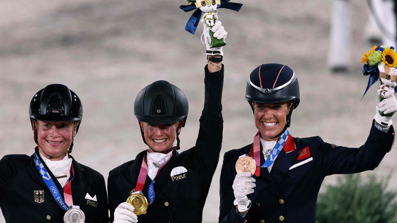 Silver medallist Germany's Isabell Werth, gold medallist Germany's Jessica von Bredow. Werndl and bronze medallist Britain's Charlotte Dujardin. Photo by Behrouz MEHRI / AFP)