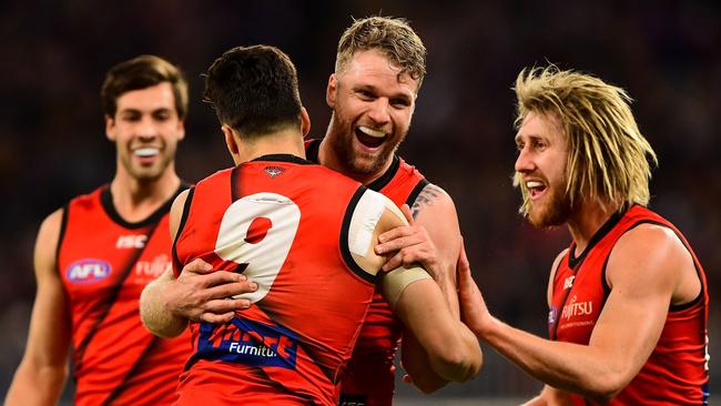 PERTH, AUSTRALIA - AUGUST 17: Jake Stringer and Dylan Shiel of the Bombers celebrates after scoring a goal during the 2019 AFL round 22 match between the Fremantle Dockers and the Essendon Bombers at Optus Stadium on August 17, 2019 in Perth, Australia. (Photo by Daniel Carson/AFL Photos)