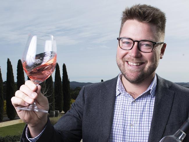 The Lane Vineyard chief executive Jared Stringer with a glass of this years vintage 2021 Pinot Noir RosÅ½ in their Vineyards near Hahndorf .Tuesday May,5,2021.Picture Mark Brake