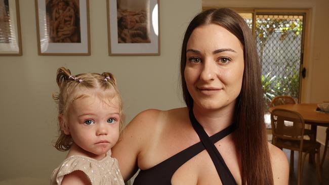 Monique Robinson, 28 with daughter Alirah, 1, at home in Shailer Park. Picture: Liam Kidston