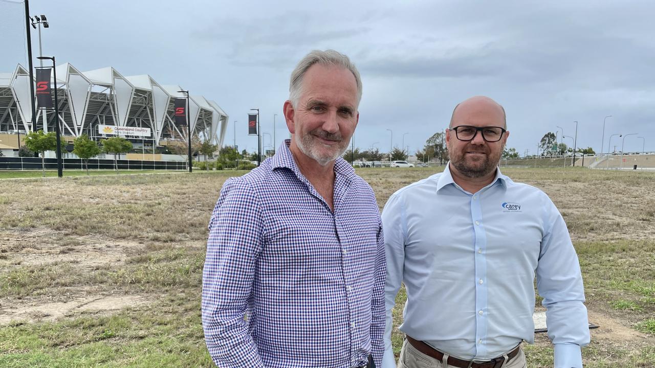 Focus Pacific chief executive Michael Graham and Carey Group chief executive Matt Thomson at the site of the future Hilton Garden Inn, next to Queensland Country Bank Stadium. Picture: Leighton Smith.