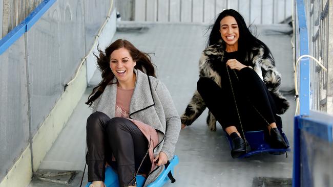 Slide Skate and Chill at The Common this Winter at Southwarf. Hannah Jarad and Lacey Higgins enjoy the toboggan. Picture: Andrew Tauber
