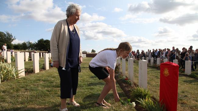 Relatives place flowers on the graves of the fallen soldiers. Picture: Australian Army