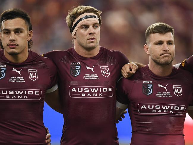 TOWNSVILLE, AUSTRALIA - JUNE 09:  Tino Fa'asuamaleaui of the Maroons, Christian Welch of the Maroons and Jai Arrow of the Maroons sing the national anthem before game one of the 2021 State of Origin series between the New South Wales Blues and the Queensland Maroons at Queensland Country Bank Stadium on June 09, 2021 in Townsville, Australia. (Photo by Ian Hitchcock/Getty Images)