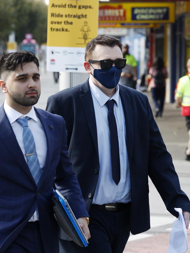 Mr Jeffries (right) leaving Parramatta Local Court after sentencing for his involvement in rental scams. Picture: Jonathan Ng