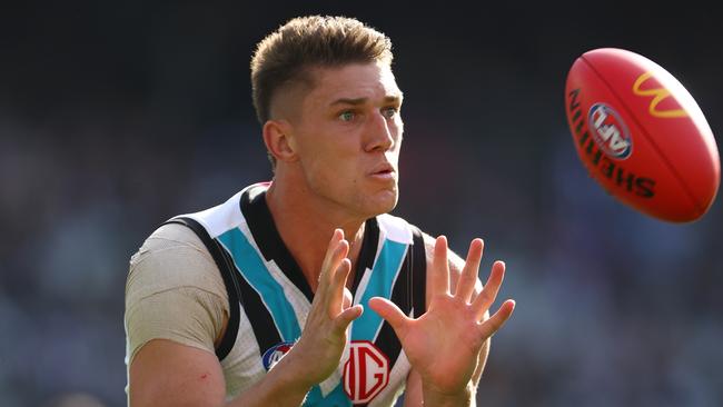 MELBOURNE, AUSTRALIA - APRIL 20: Jordon Sweet of the Power marks during the round six AFL match between Collingwood Magpies and Port Adelaide Power at Melbourne Cricket Ground, on April 20, 2024, in Melbourne, Australia. (Photo by Quinn Rooney/Getty Images)