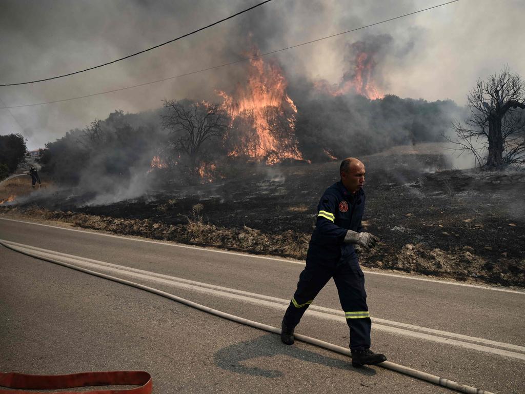 A Greek firefighter battles a forest fire spreading in Dikella near Alexandroupoli. Picture: AFP