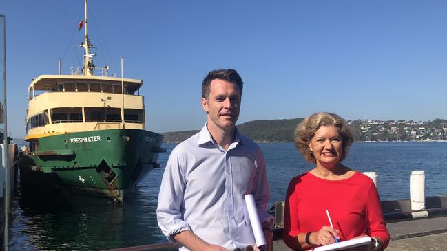 Shadow Transport Minister Chris Minns and Cr Candy Bingham, in front of one of Manly's iconic Freshwater class ferries, which will soon disappear under a shake-up of ferry services. Picture: Julie Cross