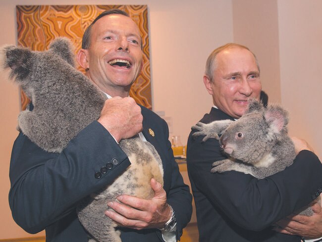 In this photo released by G20 Australia and taken on Saturday Nov 15, 2014, Prime Minister of Australia Tony Abbott and President of Russia Vladimir Putin hold koala's during a photo opportunity on the sidelines of the G-20 summit in Brisbane, Australia. (AP Photo/G20 Australia,Andrew Taylor)