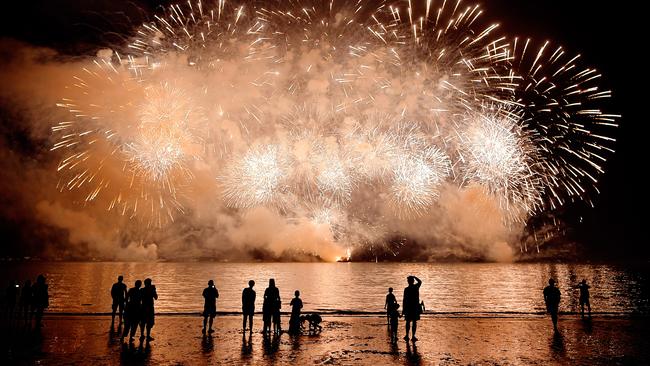 Territorians watch on as the main fireworks display goes off with a bang at the Mindil Beach Territory Day 2017 celebrations.