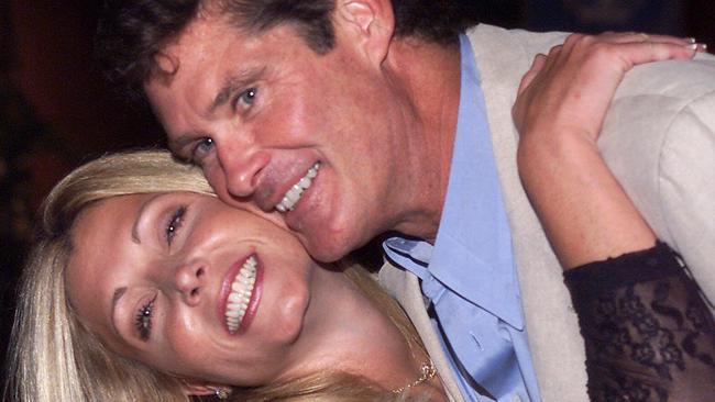 ** FILE ** Pamela Bach, left, poses with husband David Hasselhoff in this Aug. 11, 2000 file photo in Los Angeles.  Less than a month after filing for divorce, Bach, the estranged wife of Hasselhoff, is alleging that the former "Baywatch" star abused her, according to court records. (AP Photo/Jill Connelly, File)