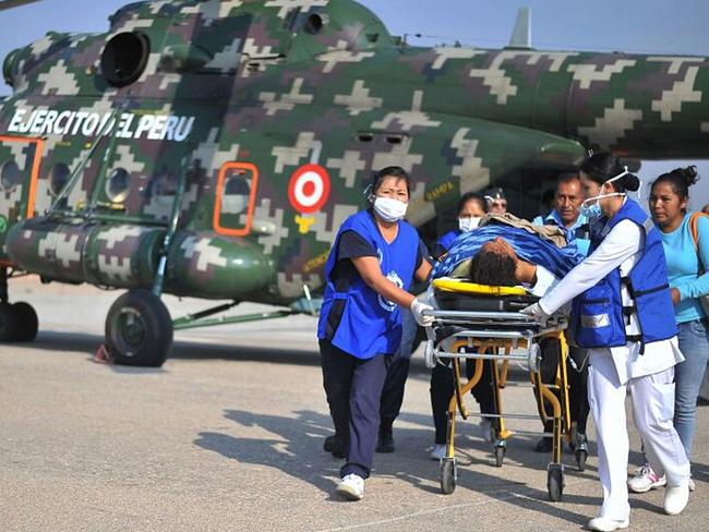 A medical team rescue injured passengers from a bus that plunged off a cliff in Peru, killing more than 40 and injuring dozens. Picture: AFP