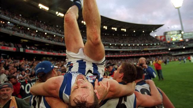 David King doing backflip after winning the 1999 flag. Picture: Herald Sun