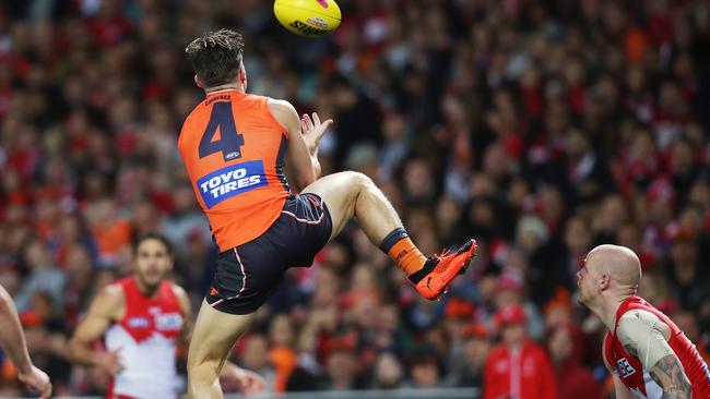 Toby Greene raises his boot as he takes a mark against the Swans. Picture: Phil Hillyard