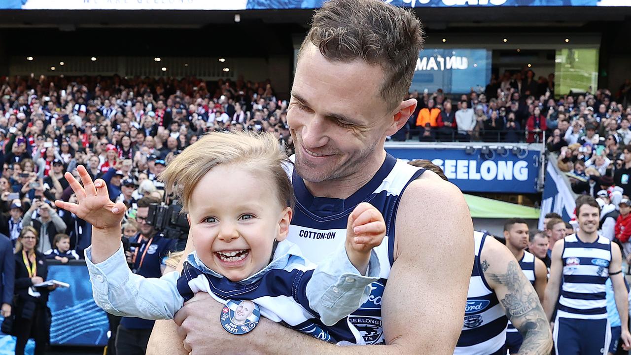 An emotional embrace between Joel Selwood and Gary Ablett after the Geelong captain carried Levi Ablett through the banner. Picture: Michael Klein