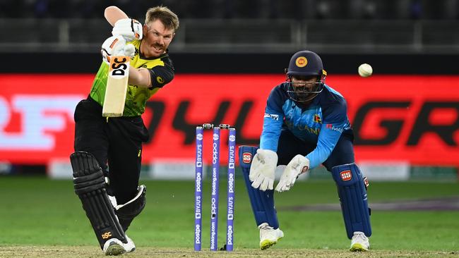 David Warner bludgeons the ball into the offside as Sri Lanka’s wicketkeeper Kusal Perera looks on Picture: Getty Images