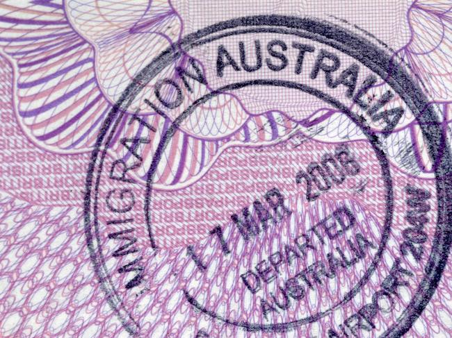 Departure stamp on the inside page of a passport.