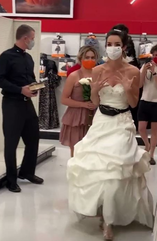 After her fiance agreed to talk outside, she storms off saying ‘I’m shaking’. She also has a pastor and bridesmaid with her. Picture: TikTok/@boymom_ashley