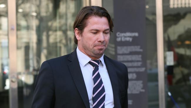 Former AFL player Shannon Grant leaves the Melbourne County Court. His appeal against a six month jail sentence was successful, his penalty reduced to a community corrections order. Picture: David Crosling/AAP