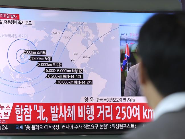 A man watches a TV news program reporting on North Korea’s missile launch at the Seoul Train Station on Saturday. Picture: Lee Jin-man/AP