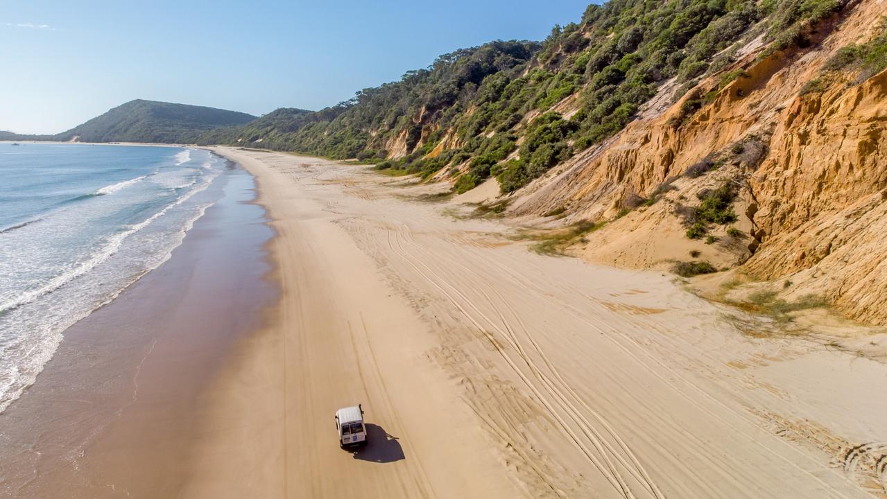 Drivers are increasingly snapping up 4WDs so they can experience moments like this at Rainbow Beach. Picture: Mark Fitz