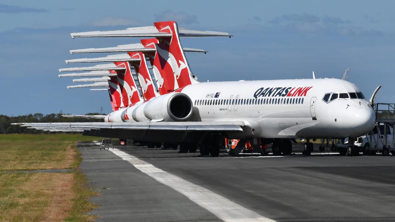 Grounded QantasLink aircraft parked at Brisbane Airport. Picture: Darren England/AAP