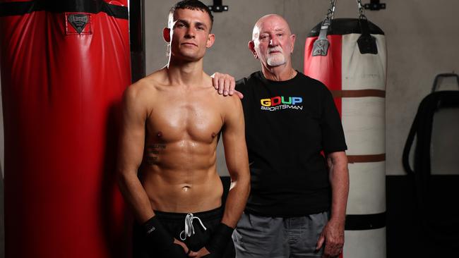 Harry Garside with his trainer Johnny Lewis. Picture: Brett Costello