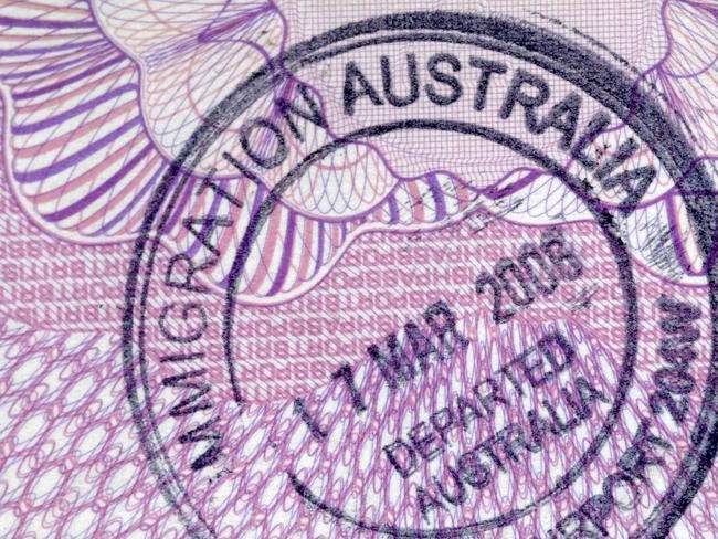 Departure stamp on the inside page of a passport.