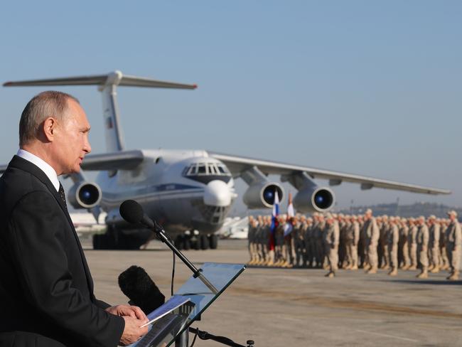 Russian President Vladimir Putin addresses the troops at the Hemeimeem air base in Syria. Several private Russian military contractors were killed by a US strike in Syria. Picture: AP