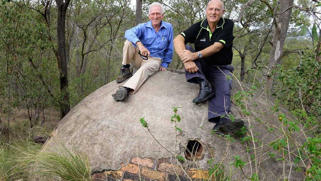 Ipswich Historical Society president Hugh Taylor and Cr Bruce Casos inspect a water tank at the site where Brynhyfryd stood at Blackstone Hill. Picture: Rob Williams