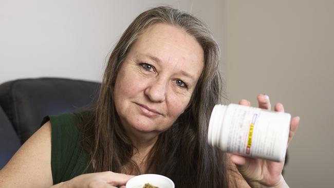 Jenny Hallam at home in Blakeview, with medical cannabis. Picture: Matt Loxton