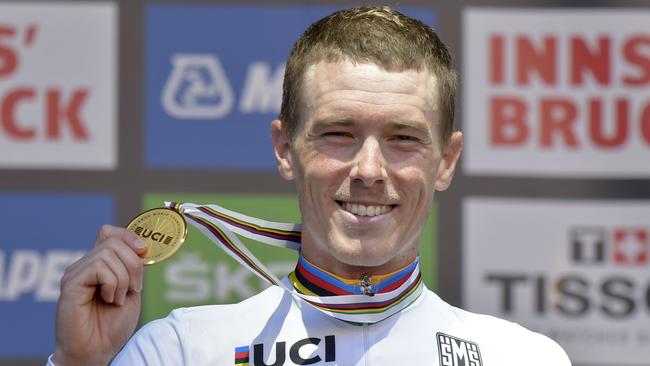 Winner Rohan Dennis of Australia celebrates on the podium after winning the Men's Individual Time Trial (ITT) road race between Rattenberg and Innsbruck during the UCI Cycling Road World Championships on September 26, 2018 in Austria. (Photo by HERBERT NEUBAUER / APA / AFP) / Austria OUT