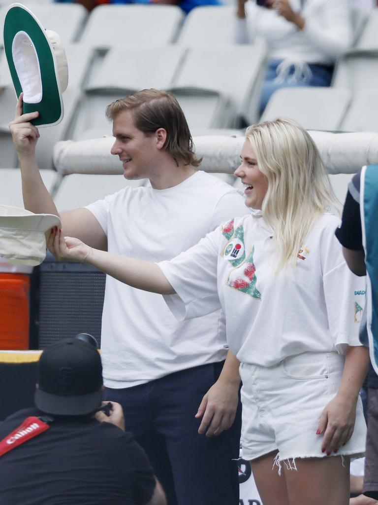 Brooke and Jackson Warne honour their dad Shane Warne on the boundary rope at 3.50pm. Picture: Michael Klein.