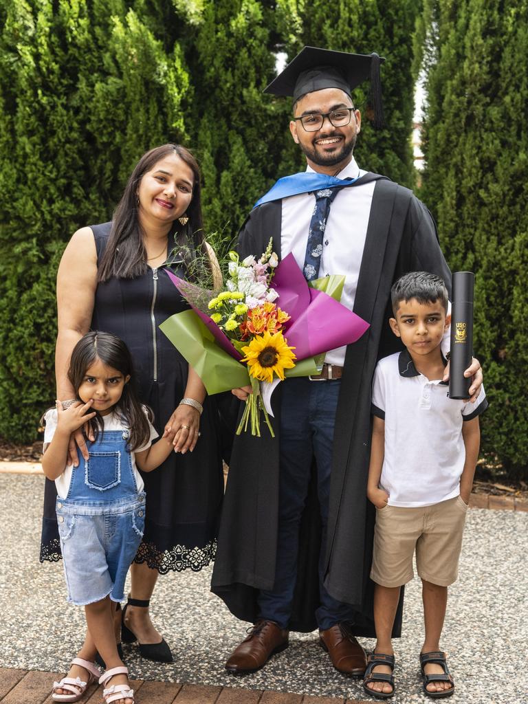 Bachelor of Nursing graduate Harsh is congratulated by sister Sudesh Rani, niece Alisha and nephew Ayaan Chahal at the UniSQ graduation ceremony at Empire Theatres, Tuesday, December 13, 2022. Picture: Kevin Farmer