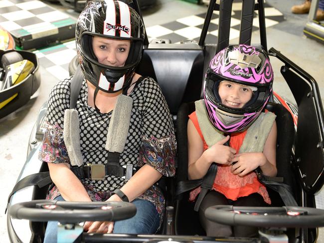 School holiday page. Go karting is always popular with the kids and was again these holidays. Pictured at Karting Madness in Chirnside Park. Kristy Sealey and her friend Anne Evans had fun with their children driving the carts. The mums got in on the action as well. Anne Evans with her daughter,Tayla.  Picture: Lawrence Pinder